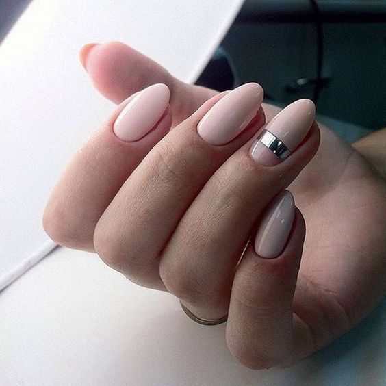 elegant nude nails with a single metallic stripe look super chic and bold
