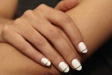 10 a modern take on French nails done in white and with a gold stripe
