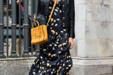 11 a black floral midi dress, a black leather jacket and black combat boots plus a yellow bag