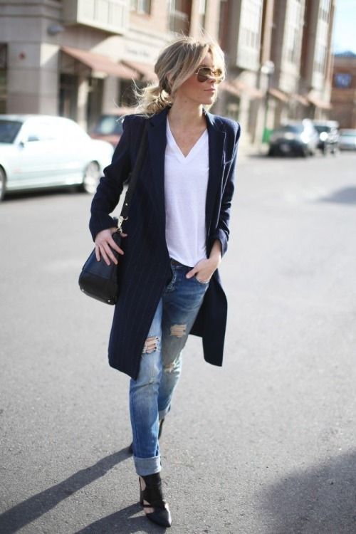 a white tee, a navy striped long cardigan, black boots
