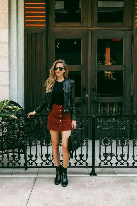 a date look with a bburgundy suede skirt, a black tee, a black leather jacket, black boots for a rock touch