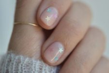 12 nude nails with colorful stars is a great and easy idea of a nail art