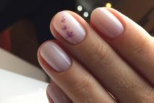 13 nude nails with little purple flowers are a very delicate and girlish option to rock