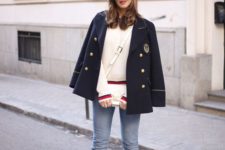 14 a navy inspired look with blue raw hem jeans, navy booties and a navy jacket