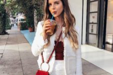 16 a white fringed suit with a mini skirt, a burgundy velvet top and an orange bag