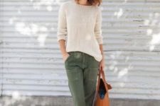 With beige shirt, olive green pants and tote