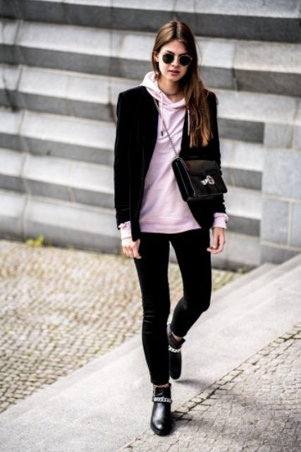 With black blazer, crossbody bag, black pants and leather boots