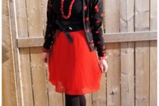With black blouse, red skirt, red shoes and black tights