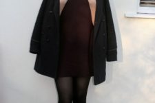 With black coat, black tights and flat shoes
