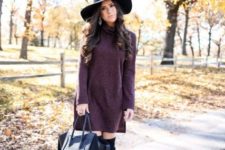 With black hat, black tote and high boots