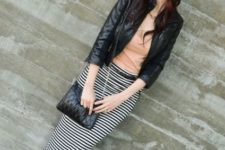 With black leather jacket, hat, chain strap bag and flat sandals