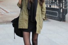 With black mini dress, scarf, leather boots and bag
