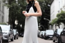 With black top, black pants and white dress