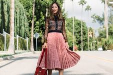 With blouse, pleated midi skirt and red bag