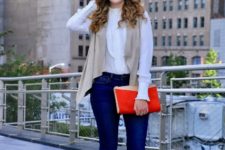 With blouse, skinny jeans, red clutch and beige high heels