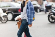 With checked jacket, brown bag, skinny jeans and golden ankle boots