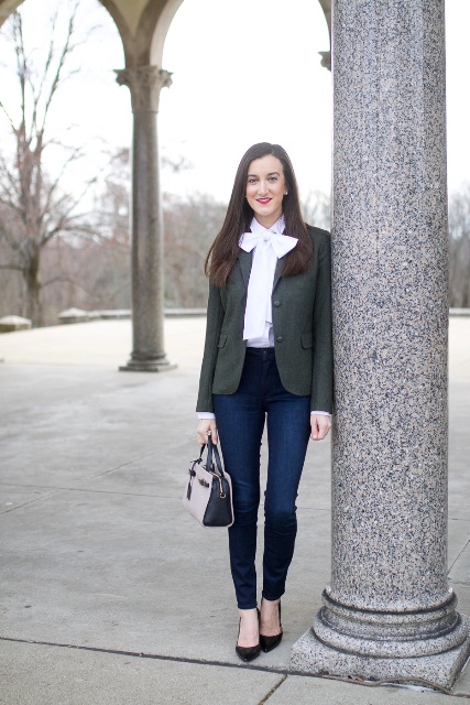With dark gray blazer, navy blue jeans, black pumps and two colored small bag