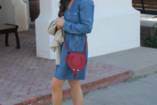With denim dress and red crossbody bag