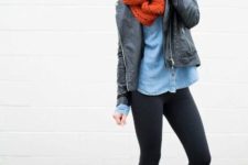 With denim shirt, black leather jacket, red scarf and leggings