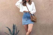 With denim skirt, brown bag and sneakers