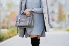 With gray coat, gray suede bag and black high boots