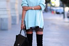 With lace skirt, high heeled boots and black bag