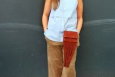 With light blue sleeveless top, fringe bag and colorful shoes