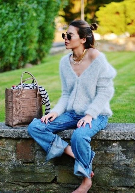 With loose jeans and beige tote