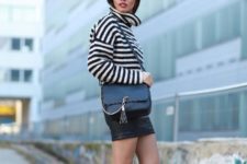 With mini skirt, black leather bag and ankle boots