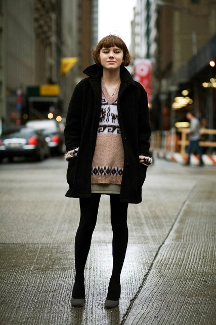 With mini skirt, gray shoes and black coat