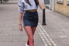 With mini skirt, red tights and white sneakers