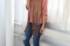 With pale pink shirt, distressed jeans and cutout boots
