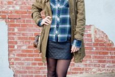 With plaid button down shirt, ankle boots and black mini skirt