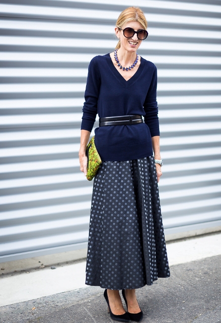 With polka dot maxi skirt, belt, printed clutch and black shoes