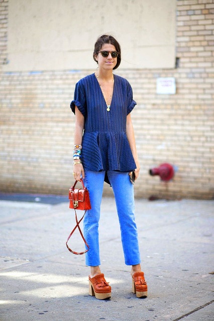 With striped blouse, straight jeans and red mini bag