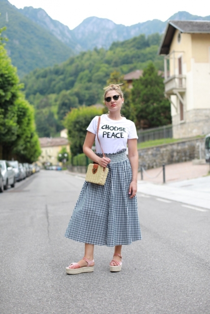 With t-shirt, straw bag and platform sandals