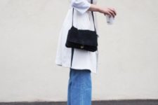 With white coat, black bag and jeans