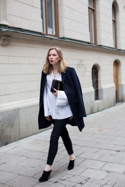 With white loose shirt, navy blue jacket, clutch and skinny pants