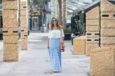 With white off the shoulder blouse and tote