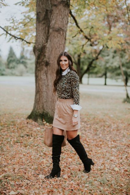 With white shirt, beige skirt, over the knee boots and beige bag