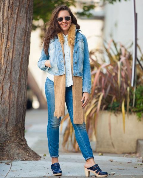 With white shirt, denim jacket, brown scarf and jeans