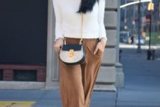 With white sweater, two colored bag and two colored pumps