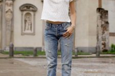 With white t-shirt, distressed jeans and sunglasses