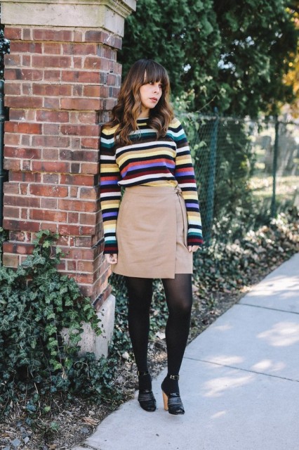 With wrap skirt, black tights and heels