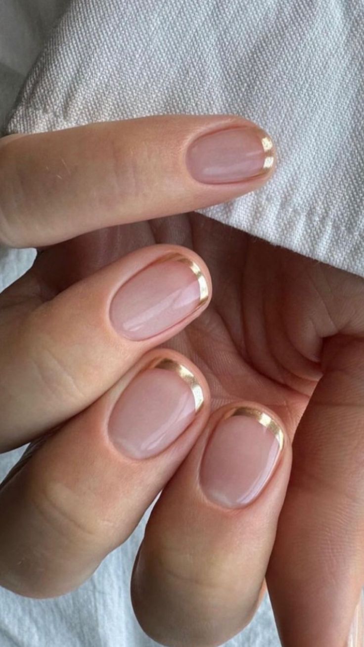 a chic gold French manicure is an alternative to usual French and it looks very bright and shiny