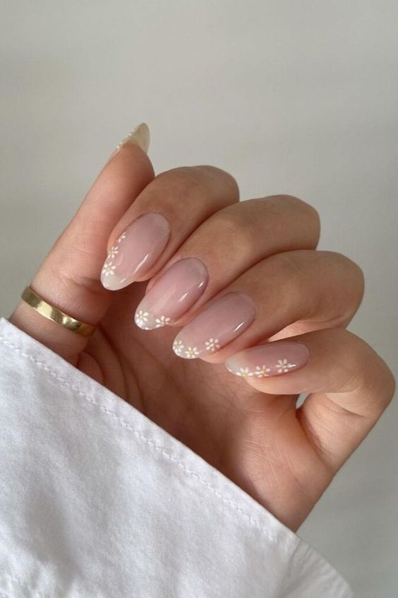 a girlish version of French manicure with little flowers forming tips is a lovely idea for spring or summer