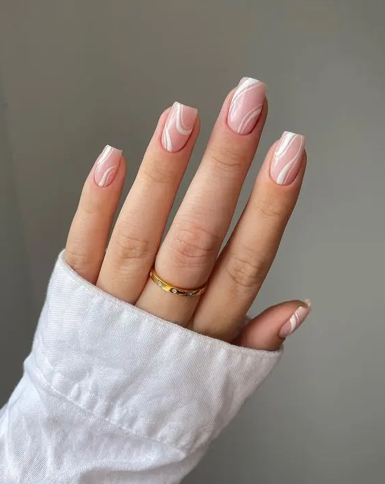 beautiful nude square nails with white patterns are grogeous to rock any time, this is a fresh idea of a nude manicure