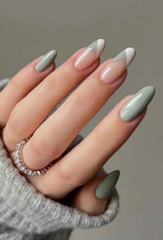 Long almond nails styled for spring with mint green and white and mint French styled tips are wow