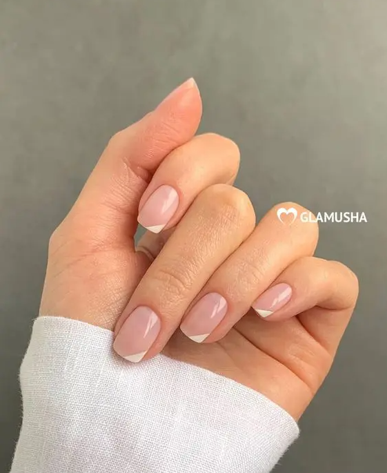 short square nude nails with white corners are a cool and fresh geometric version of French manicure