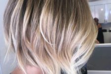 05 a dark root, blonde to silver balayage on a shaggy haircut for a bold look